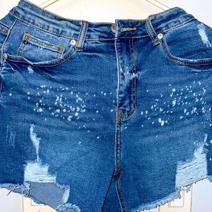 Blue ripped short jean shorts. Size M